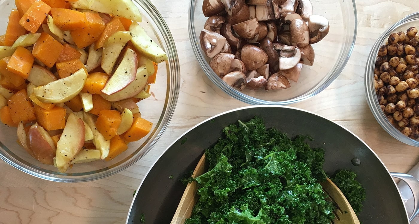 bowls of kale, mushrooms, and potatoes